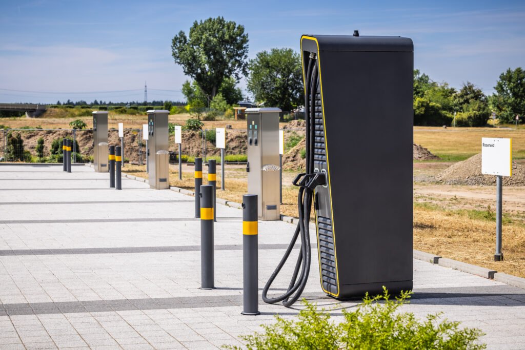Power supply for electric car charging, charger at parking lot.